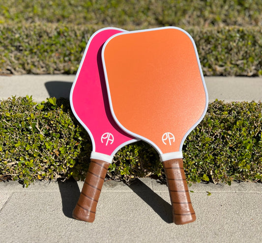 stylish pink and orange pickleball bats